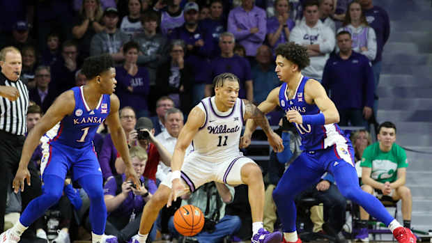 Kansas forward Jalen Wilson defends Kansas State guard Keyontae Johnson
